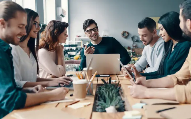 A leadership team running an engaging company town hall meeting
