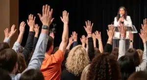 People Raising their hands for a Speaker
