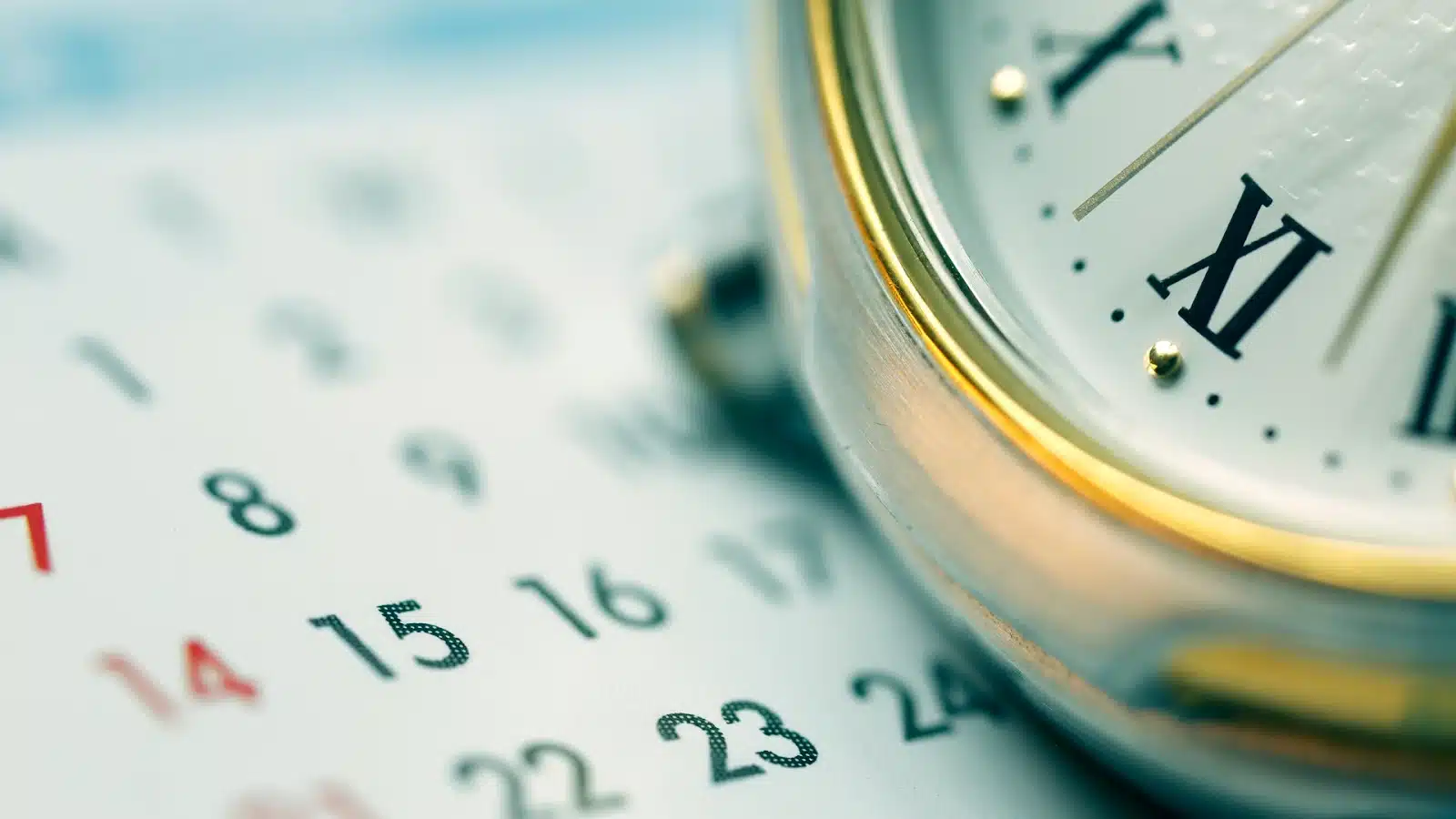 A watch on top of a calendar